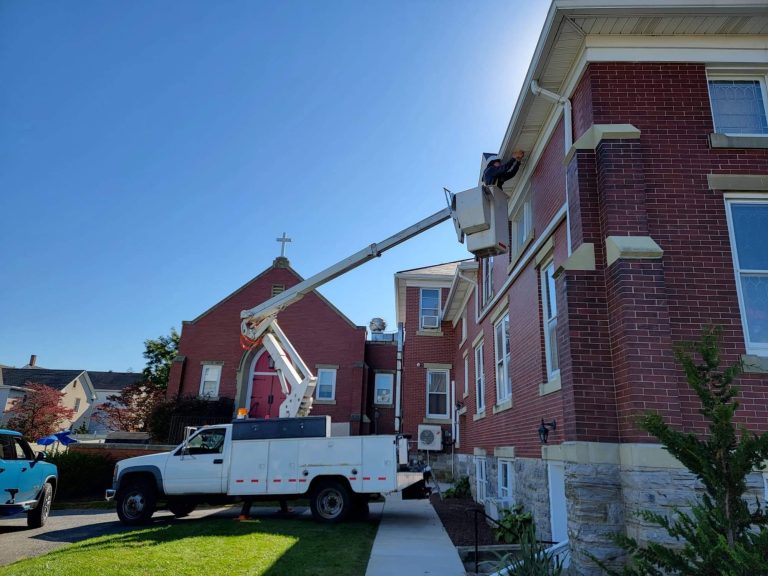 CermakTech bucket truck installing cameras at a church in Waynesboro